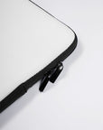 a close up of a zipper on a white laptop